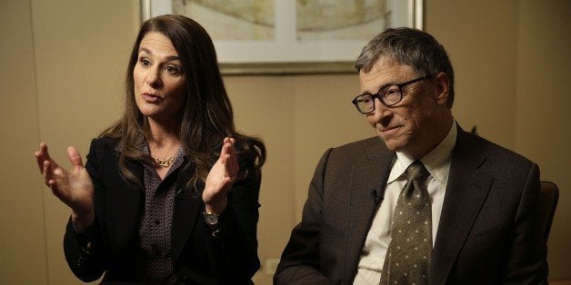 Bill Gates listens while his wife Melinda Gates talks during an interview in New York, Wednesday, Jan. 21, 2015. As the world decides on the most crucial goals for the next 15 years in defeating poverty, disease and hunger, the $42 billion Gates Foundation announces its own ambitious agenda. (AP Photo/Seth Wenig)