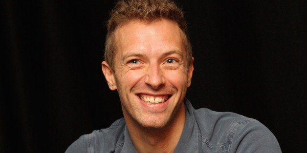LONDON, ENGLAND - OCTOBER 25: Chris Martin of Coldplay smiles during a question and answer session at Absolute Radio on Octo