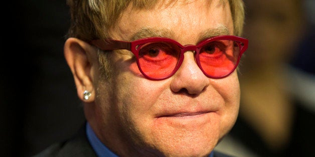 Musician Sir Elton John arrives on Capitol Hill in Washington, Wednesday, May 6, 2015, to testify before the Senate State, Fo