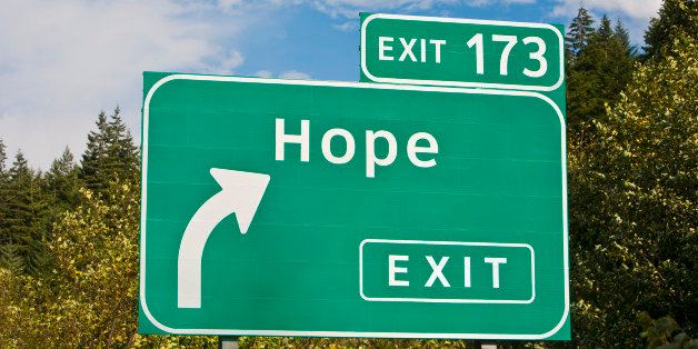 Highway sign illustrating the concept of 'Hope is just around the corner,' or 'this way for Hope'
