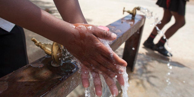 JOHANNESBURG, SOUTH AFRICA - OCTOBER 15: Children learn to wash their hands with Lifebuoy soap, at Margeret Gwele Primary School, Soweto, on October 15, 2012 in Johannesburg, South Africa. Celebrated in over 100 countries, Global Handwashing Day is an annual awareness day which aims to put the global spotlight on handwashing with soap as a lifesaving habit. (Photo by Greg Marinovich/Getty Images for Unilever)