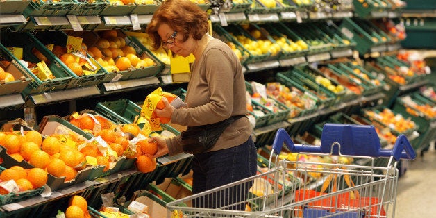 LONDON, ENGLAND - APRIL 20: Shoppers peruse items on sale in the Tesco Extra superstore on April 20, 2009 in New Malden, Sur