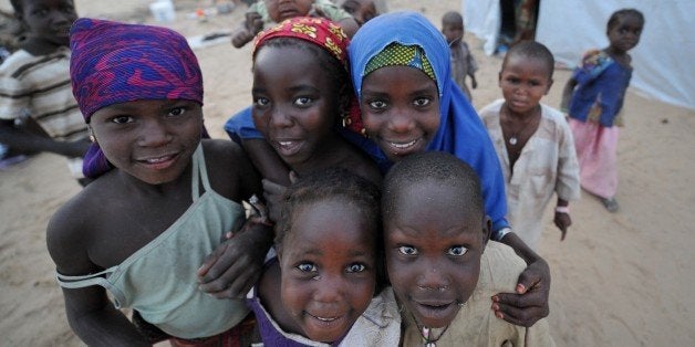 In this picture taken on January 26, 2015 a Nigerian refugee children pose for a photograph at a United Nations High Commission for Refugees (UNHCR) camp in Baga Sola. Refugees arrived in the camp after the recent attack by Boko Haram millitants in the Nigerian town of Baga. AFP PHOTO/ SIA KAMBOU (Photo credit should read SIA KAMBOU/AFP/Getty Images)