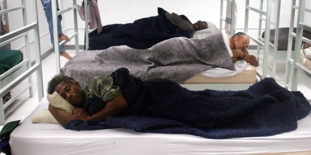 HOUSTON, TX - SEPTEMBER 23: Men, mostly homeless, fill the beds at the Salvation Army shelter September 23, 2005 in Houston, Texas. About 300 people, more than double the average number, fled to the shelter to escape Hurricane Rita. (Photo by Scott Olson/Getty Images)