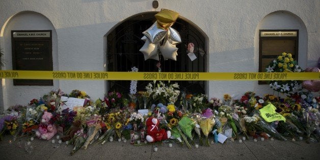 A morning view of a memorial outside the Emanuel AME Church June 19, 2015 in Charleston, South Carolina. US police arrested a