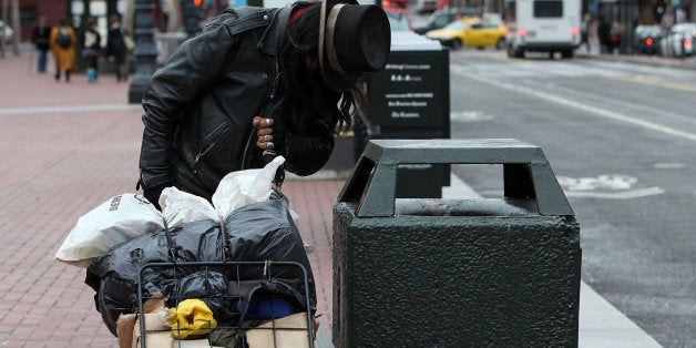 SAN FRANCISCO - JANUARY 25: A homeless man named Joe looks for recyclables in a trash can on Market Street January 25, 2010 in San Francisco, California. San Francisco Mayor Gavin Newsom announced ambitious plans during his recent State of the City address to reduce the city's overall homeless population by one third and the street population by one half before being termed out of office in two years. Over 6,500 homeless people live on the streets and in shelters in San Francisco. (Photo by Justin Sullivan/Getty Images)