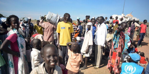 In this photo taken Monday, June 29, 2015, newly-arrived displaced people register to receive food and other aid at the UN ba