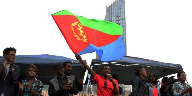 ADDIS ABABA, ETHIOPIA - JUNE 26: An Eritrean refugee waves an Eritrea flag during a demonstration in front of the African Uni