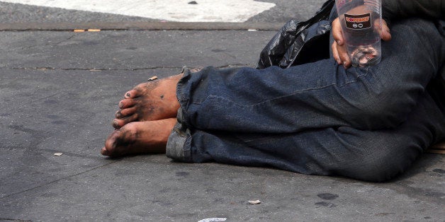 A homeless man asks for money on 14th Street, Friday, Sept. 4, 2015, in New York. The number of homeless on New York City's streets has increased, prompting breathless media coverage and worries that the "bad old days" are returning to the Big Apple. (AP Photo/Mary Altaffer)