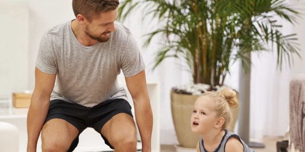 Full length shot of a father and daughter working out together