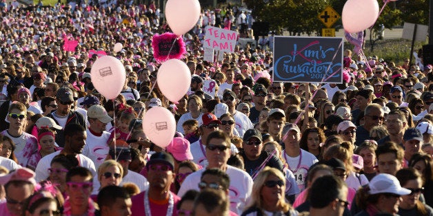 DENVER, CO - SEPTEMBER 28: Thousans of runners and walkers start the 5K inspiration run of the 22nd annual Susan G. Komen Colorado Race for the Cure in Denver, CO on September 28, 2014. Thousands took part in the annual race which started and finished on the Auraria Parkway near the Pepsi Center. Breast cancer remains the most common form of cancer among women living in the United States. In Colorado 1 in 7 women will be diagnosed with breast cancer in their lifetime. Events like Race for the Cure help fund grants to community organizations who provide breast health services to those diagnosed. (Photo By Helen H. Richardson/ The Denver Post)