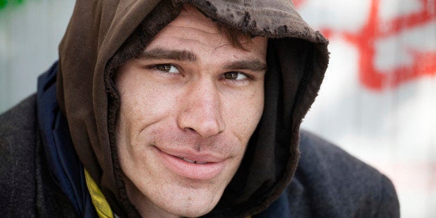 one Homeless Men Being Friendly and smiling Outdoor