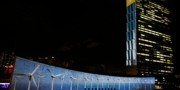 NEW YORK, NY - SEPTEMBER 22: Big scale projections are seen over the general assembly building at United Nations headquarters on September 22, 2015 in New York City. The projections and peoples voices are seen during the celebration of UN70 and visually depict the 17 Global Goals. (Kena Betancur/Getty Images for Global Goals)