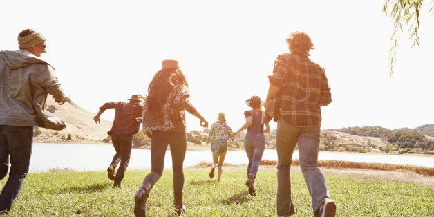 Friends running in park