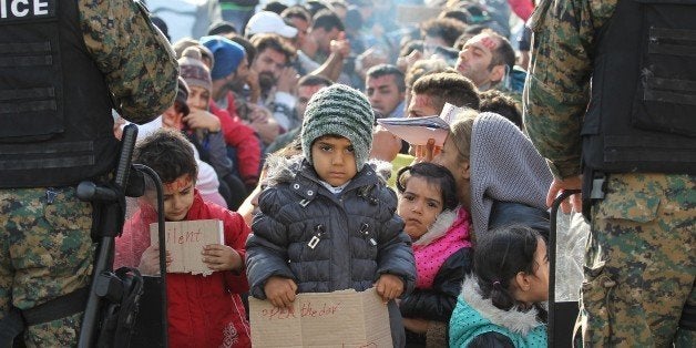 GEVGELIJA, MACEDONIA - NOVEMBER 24: Refugees stage a protest against governments' double standards over refugee admittance policies, other than Syrians, as they wait at Macedonia- Greek border in Gevgelija, Macedonia on November 24, 2015. (Photo by Ilin Nikolovski/Anadolu Agency/Getty Images)