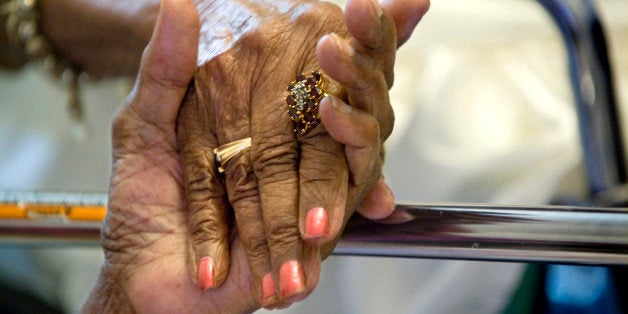 WASHINGTON, DC JULY 8: One hundred and ten-year-old patient Eddye Williams and her 85-year-old daughter Edythe Simmons hold hands at her home in Washington, DC on July 8, 2010. The pair are able to live and be taken care of together in their home thanks to a house call pilot program being run by Washington Hospital. A team of geriatricians, nurse practitioners and social workers make house calls to the most ill and disabled patients who are to sick or immobile to get to the doctor. Its a pilot program funded by the Independence at Home Act. It's part of a pilot program being run by Washington Hospital. Williams and her daughter, Edythe Simmons, 85, both are in the program as the daughter has had a stroke and in remission from breast cancer. ( Photo by Linda Davidson/ The Washington Post via Getty Images)