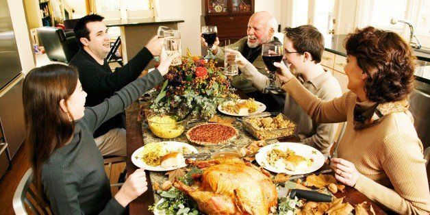Family toasting at Thanksgiving meal