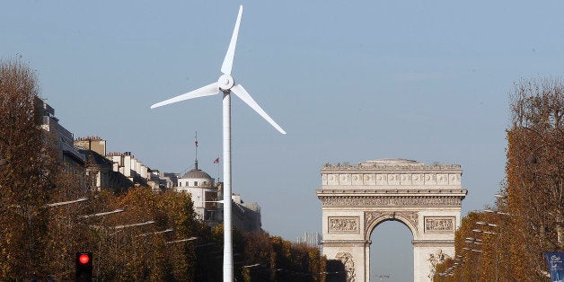 PARIS, FRANCE - NOVEMBER 26: A wind turbine is installed to provide electricity for Christmas illuminations on the Champs-Elysee on November 26, 2015 in Paris, France. This event takes part of the organisation of the Conference on Climate Change COP21. COP21 will gather 193 countries in Paris from November 30 to December 11, 2015. (Photo by Chesnot/Getty Images)