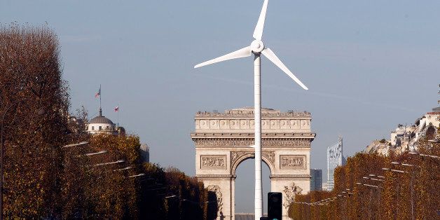 PARIS, FRANCE - NOVEMBER 26: A wind turbine is installed to provide electricity for Christmas illuminations on the Champs-Elysee on November 26, 2015 in Paris, France. This event takes part of the organisation of the Conference on Climate Change COP21. COP21 will gather 193 countries in Paris from November 30 to December 11, 2015. (Photo by Chesnot/Getty Images)