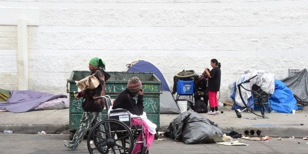 Homeless women prepare for another day and night on the street near Skid Row in Los Angeles, California on May 12, 2015. A report released by the Los Angeles Homeless Authority on May 11 showed a 12% increase in the homeless population in both Los Angeles city and county, which according to the report have been driven by soaring rents, low wages and stubbornly high unemployment. One of the most striking findings from the biennial figures released saw the number of makeshift encampments, tents and vehicles occupied by the homeless increased 85%. AFP PHOTO / FREDERIC J. BROWN (Photo credit should read FREDERIC J. BROWN/AFP/Getty Images)