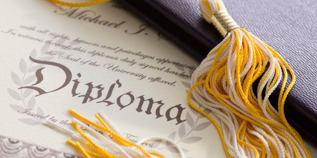 Close-up view of graduation tassel and diploma