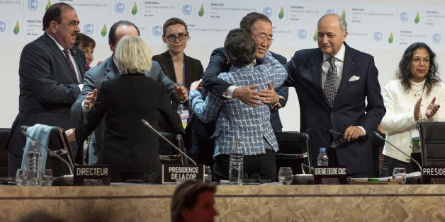 PARIS, FRANCE - 2015/12/12: Chief Ban Ki-Moon (C) hugs Executive Secretary of the United Nations Framework Convention on Climate Change (UNFCCC) Christiana Figueres (C) after the adoption of a historic global warming pact at the COP21 Climate Conference in Paris. (Photo by Jonathan Raa/Pacific Press/LightRocket via Getty Images)