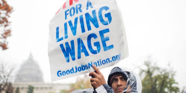 UNITED STATES - NOVEMBER 10: On the day of a Republican presidential debate, striking workers attend a rally in Upper Senate Park with Sen. Bernie Sanders, I-Vt., to call for a minimum wage of $15 per hour, November 10, 2015. Many of the low-wage workers hold jobs on Capitol Hill. (Photo By Tom Williams/CQ Roll Call)