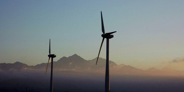 Sunrise over a wind farm in the Gobi Desert en route from Urumqi to Turpan. The apparent tranquility belies the howling hurricane force wind that sustains this wind farm. 