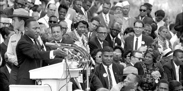 In this Aug. 28, 1963 photo, The Rev. Dr. Martin Luther King Jr., head of the Southern Christian Leadership Conference, gestu