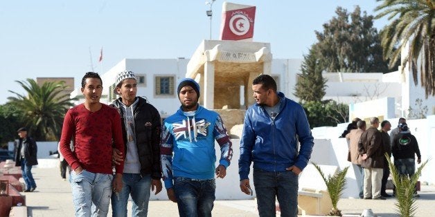 Tunisian graduates and unemployed youth walk on Mohamed Bouazizi square on December 14, 2015, in the impoverished central tow