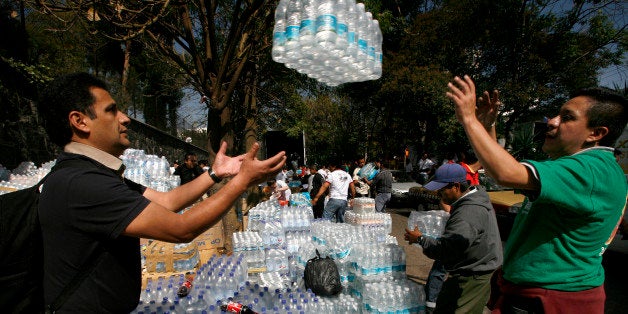 Workers load humanitarian aid for Haiti at Haiti's embassy in Mexico City, Saturday, Jan. 16, 2010. The International Red Cross and other aid groups are organizing a major disaster relief effort in Haiti after a powerful earthquake struck the capital Tuesday. (AP Photo/Marco Ugarte)