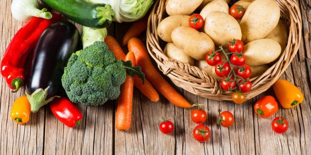 Fresh vegetable on old wooden table, top view