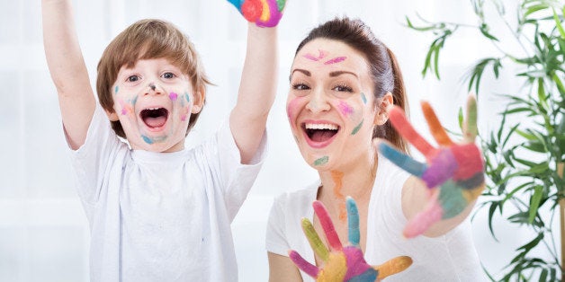 Child painting with mum