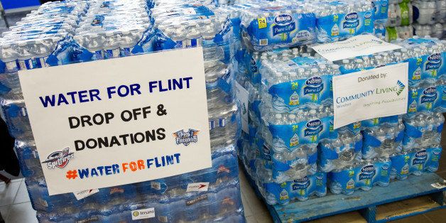 WINDSOR, ON - JANUARY 21: Fans bring in donations of bottled water prior to the game between the Flint Firebirds and the Windsor Spitfireson January 21, 2016 at the WFCU Centre in Windsor, Ontario, Canada. The Windsor Spitfires organization requested that fans bring in a donation of bottled water to help with the Flint Michigan water crisis. (Photo by Dennis Pajot/Getty Images)