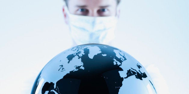 Scientist holding black and white globe