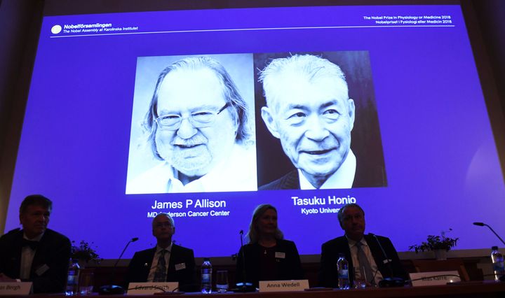 Nobel prize laureates James P. Allison, left, and Tasuku Honjo are shown during the presentation in Stockholm on Oct. 1.