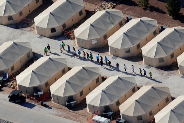Immigrant children shown walking in single file at the Tornillo, Texas, tent city on June 19, 2018.