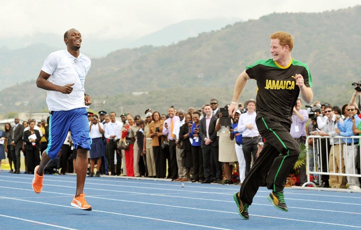 Prince Harry racing against Usain Bolt at the University of the West Indies in Jamaica in 2012. 