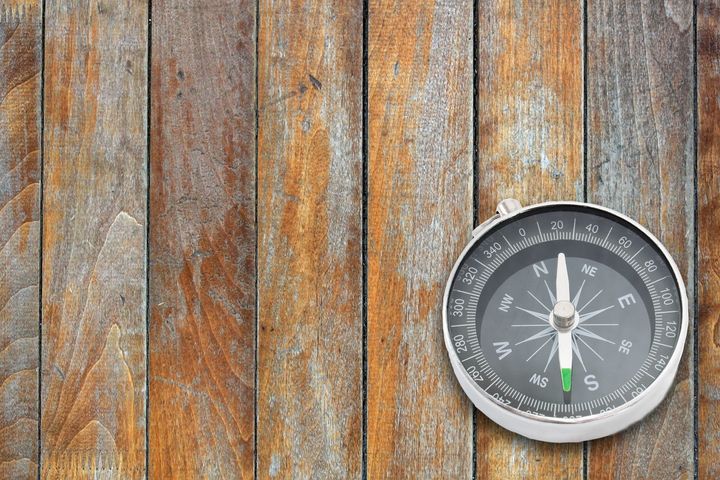compass on the old wooden board ...
