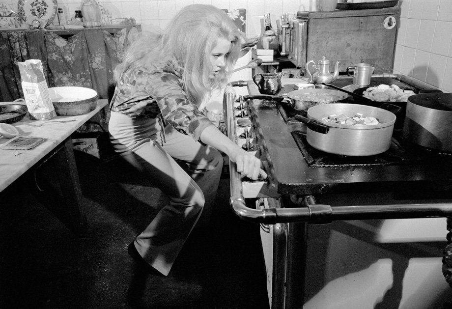 Jane Fonda cooking in her kitchen in France in 1967