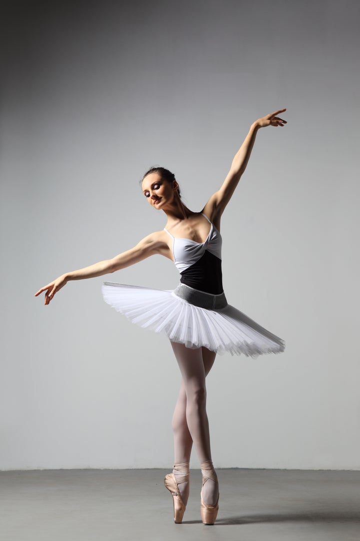 modern style dancer posing on studio background