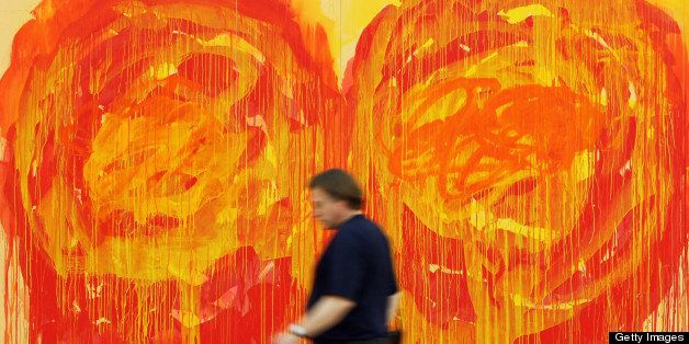 MUNICH, GERMANY - MAY 15: (EDITORS NOTE: EDITORIAL USE ONLY) A man walks past a painting depicting roses by artist Cy Twombly at the museum Brandhorst on May 15, 2009 in Munich. The museum which shows works from the contemporary arts collection of Udo and Anette Brandhorst is set to open to the public on May 21, 2009. (Photo by Miguel Villagran/Getty Images)