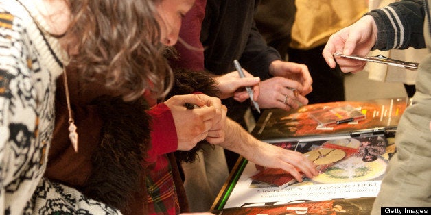 LEAMINGTON SPA, UNITED KINGDOM - MARCH 29: Douglas Castle, Harrison Koisser, Sam Koisser and Dominic Boyce of Peace meet fans and sign merchandise after their instore gig at Head Records to promote the release of their debut album 'In Love' on March 29, 2013 in Leamington Spa, England. (Photo by Ollie Millington/Redferns via Getty Images)