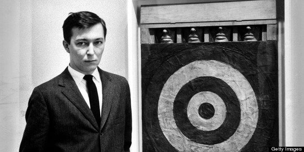 Artist Jasper Johns, standing beside his mixed-media painting Target. (Photo by Ben Martin//Time Life Pictures/Getty Images)