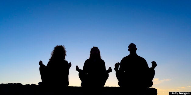 three friends making yoga.