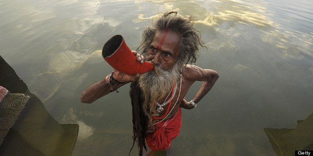 An Indian 'sadhu' - holy man' blows a buffalo horn on the eve of the traditional Kharchi Puja festival at Agartala, the capital of northeastern state of Tripura on July, 15, 2013. Kharchi Puja is one of the most important festivals of Tripura and is a week-long festival during which 14 gods are worshipped. AFP PHOTO/ ARINDAM DEY (Photo credit should read ARINDAM DEY/AFP/Getty Images)