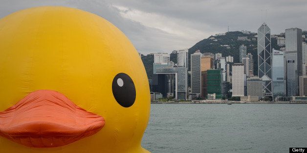 The 16.5-metre-tall inflatable Rubber Duck art installation is seen at the Victoria Harbour in Hong Kong on May 2, 2013. The inflatable duck by Dutch artist Florentijn Hofman will be on display in the former British colony until June 9. AFP PHOTO / Philippe Lopez (Photo credit should read PHILIPPE LOPEZ/AFP/Getty Images)