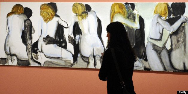 A visitor looks at the painting 'Couples' of Marlene Dumas (1994) during the opening of the exhibition 'Tears of Eros' at the Thyssen-Bornemisza museum in Madrid, on October 19, 2009. AFP PHOTO / DOMINIQUE FAGET (Photo credit should read DOMINIQUE FAGET/AFP/Getty Images)