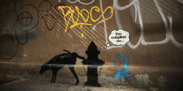 NEW YORK, NY - OCTOBER 03: A new Bansky work on a side of a wall is viewed on October 3, 2013 in New York City. New work by