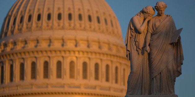 The Peace Monument memorial stands in front of the U.S. Capitol in Washington, D.C., U.S., on Sunday, Sept. 29, 2013. The U.S. government stands poised for its first partial shutdown in 17 years at midnight tonight, after a weekend with no signs of negotiations or compromise from either the House or Senate to avert it. Photographer: Andrew Harrer/Bloomberg via Getty Images